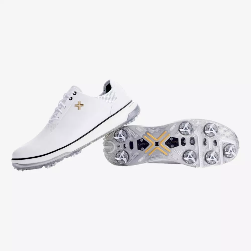 A pair of white golf shoes with yellow accents; one shoe is upright showing the side view, while the other displays the sole with multiple cleats and a yellow X-shaped design, reflecting the style seen in the best Jordan golf shoes.