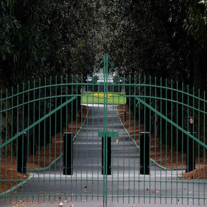 The gates of Augusta National, home of the Masters, closed and locked in 2020.
