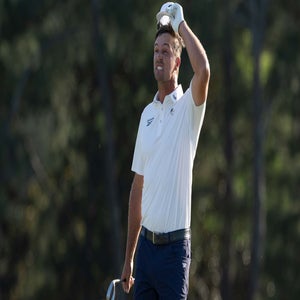 Bryson DeChambeau reacts on Augusta National's 18th green at the 2026 Masters after missing the cut.