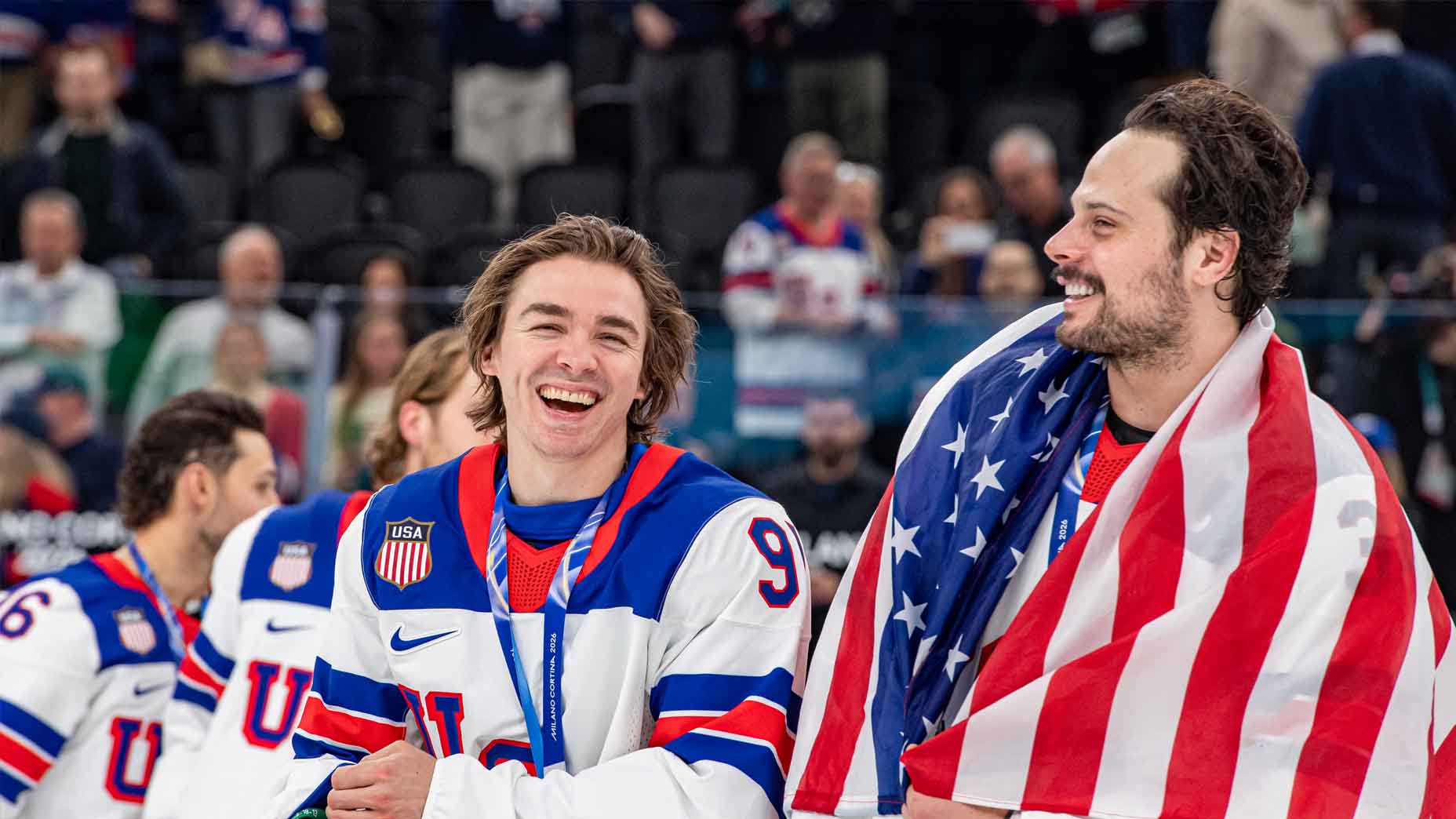 Clayton Keller and Auston Matthews celebrate after the Gold Medal game