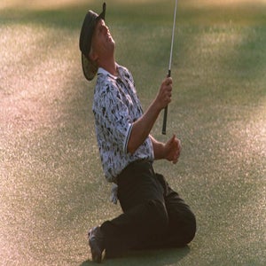 Greg Norman collapses on the ground after a chip on the 15th green during the final round of the 1996 Masters.