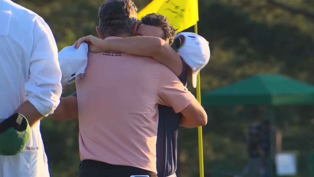 Justin Rose and Rory McIlroy embrace at the Masters