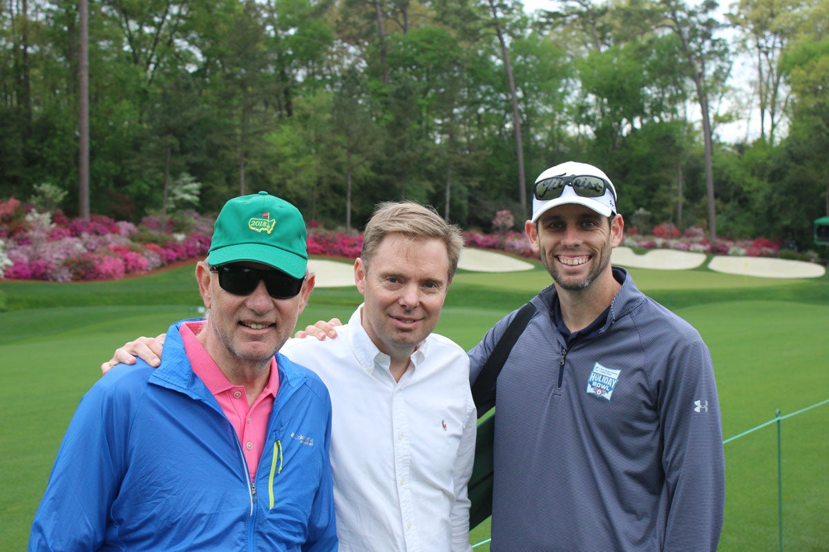 Marc Sawyer, his brother and their dad at the 2018 Masters.