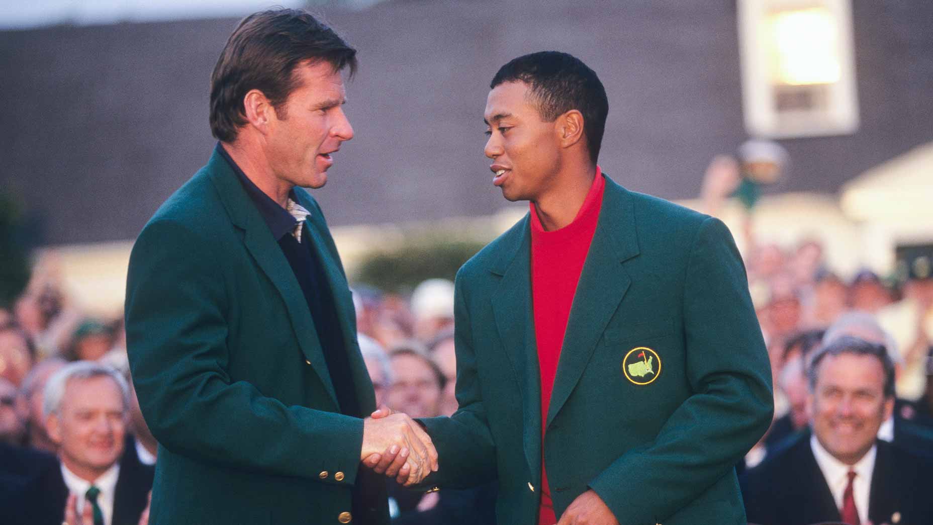 Nick Faldo shakes Tiger Woods hands at the 1997 Masters green jacket ceremony.
