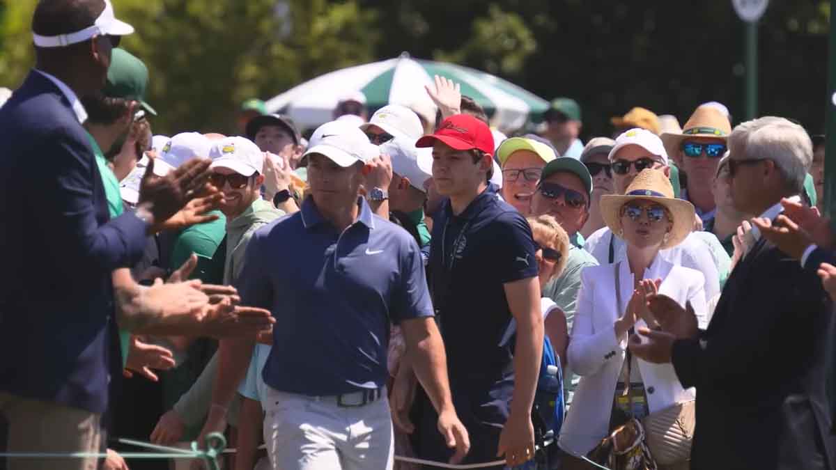 Rory McIlroy walks to the first tee at the Masters