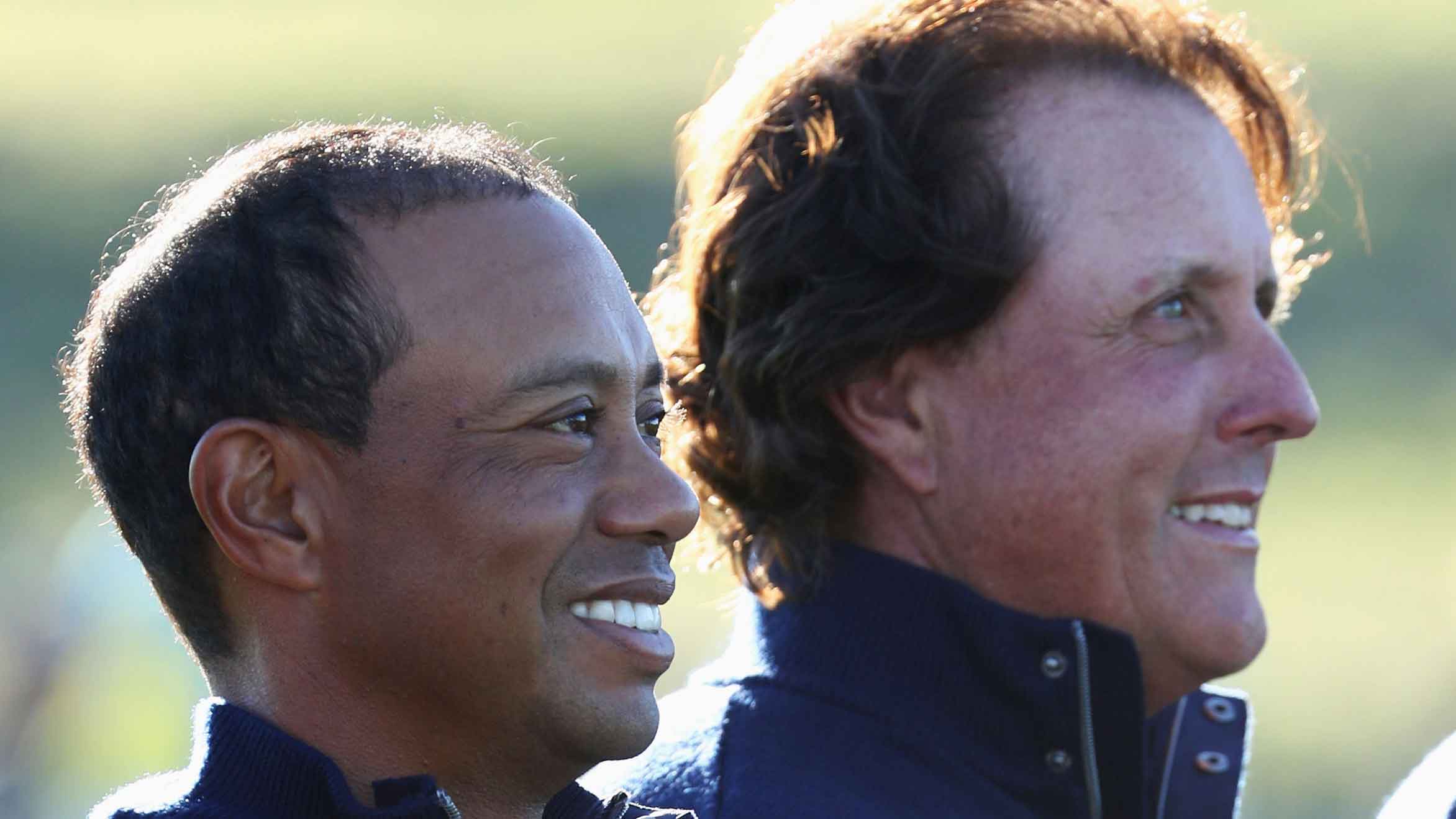 Tiger Woods of the United States and Phil Mickelson of the United States look on during a photocall ahead of the 2018 Ryder Cup at Le Golf National