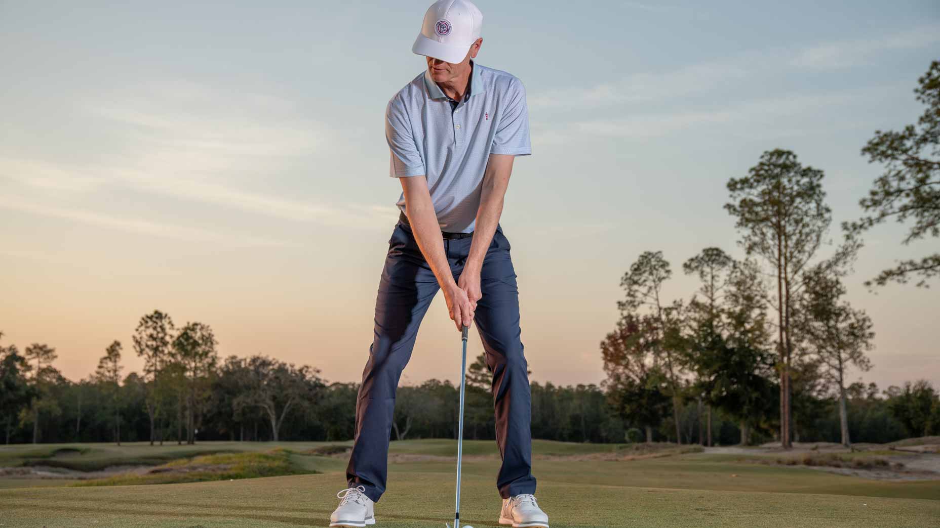 tim cooke deomstrates the proper posture in the golf swing