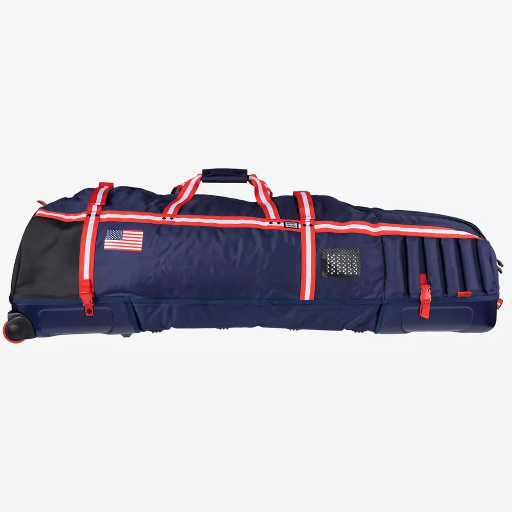 A large navy blue rolling sports bag with red and white zippers, a handle on top, and an American flag patch on the side—ideal for carrying equipment like best golf rangefinders. Several exterior pockets and compartments are visible.