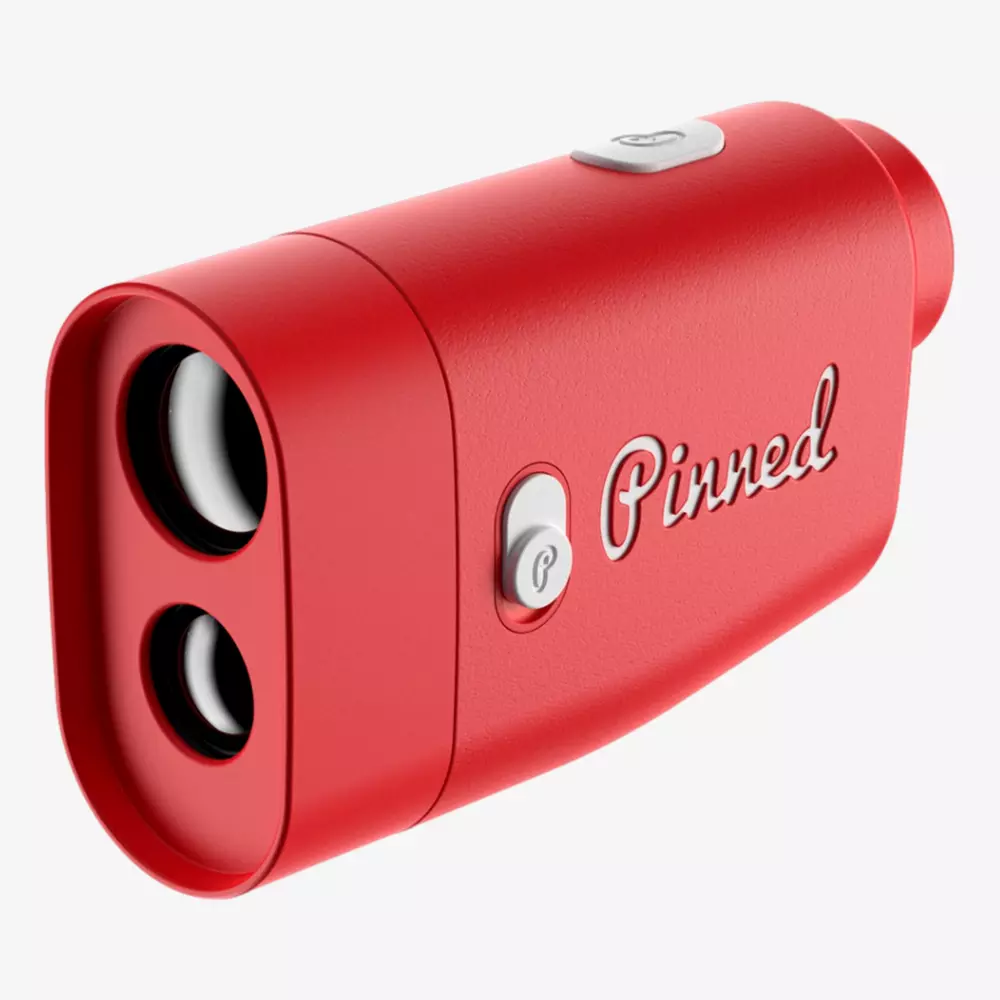 A red handheld rangefinder with two lenses and a button on top. The word Pinned is written on the side in cursive script—one of the best deals under $50 for golf or outdoor adventures.