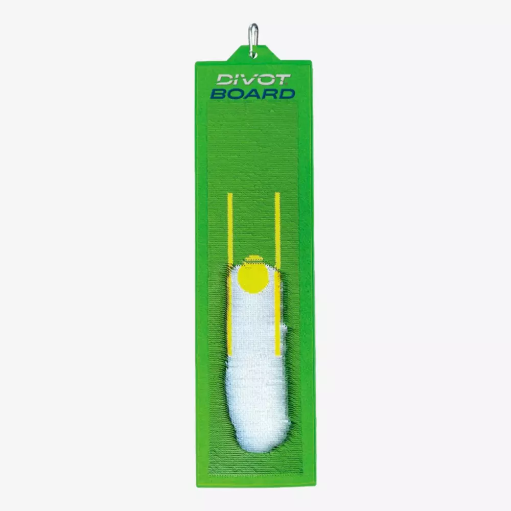 A green rectangular Divot Board golf training aid with a white impact mark and yellow alignment lines, used for practicing and analyzing golf swing paths&mdash;now available with some of the best deals under $50.