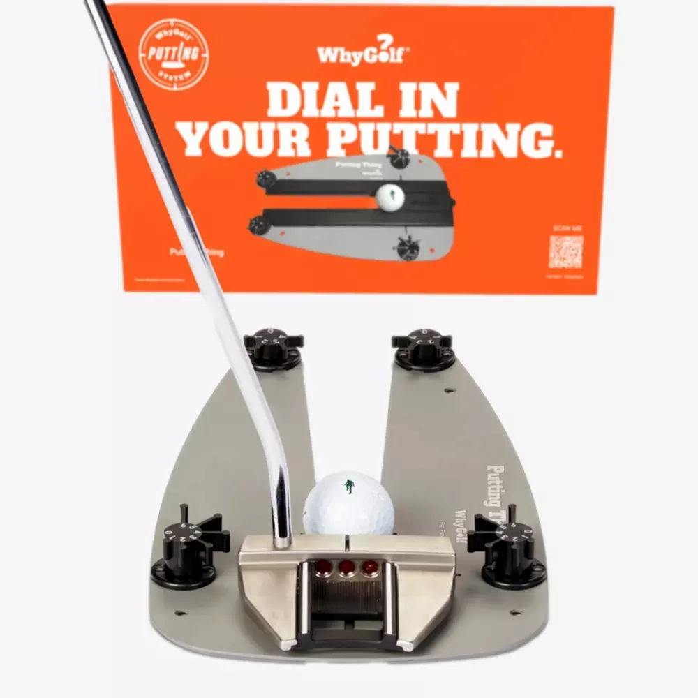 A golf putting training device holds a golf ball in place with a putter poised to strike. Behind it, an orange sign reads, WhyGolf: Dial In Your Putting&mdash;one of the best deals under $50 for golfers aiming to improve their game.