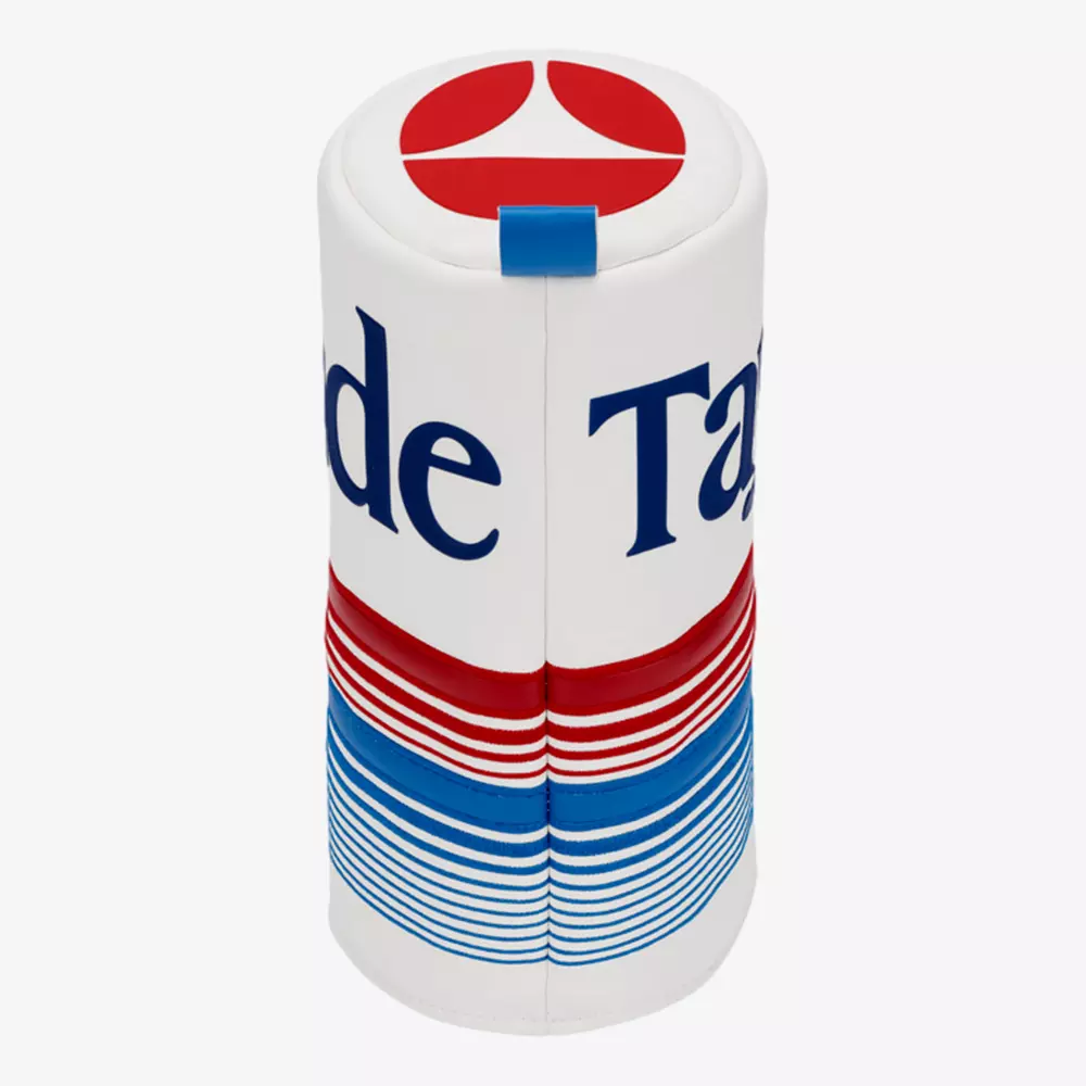A cylindrical object designed to look like a retro Tab soda can, featuring red, white, and blue horizontal lines and partial text spelling &ldquo;Tab&rdquo;&mdash;the perfect novelty gift for those who love searching for the best golf deals for $100 or less.
