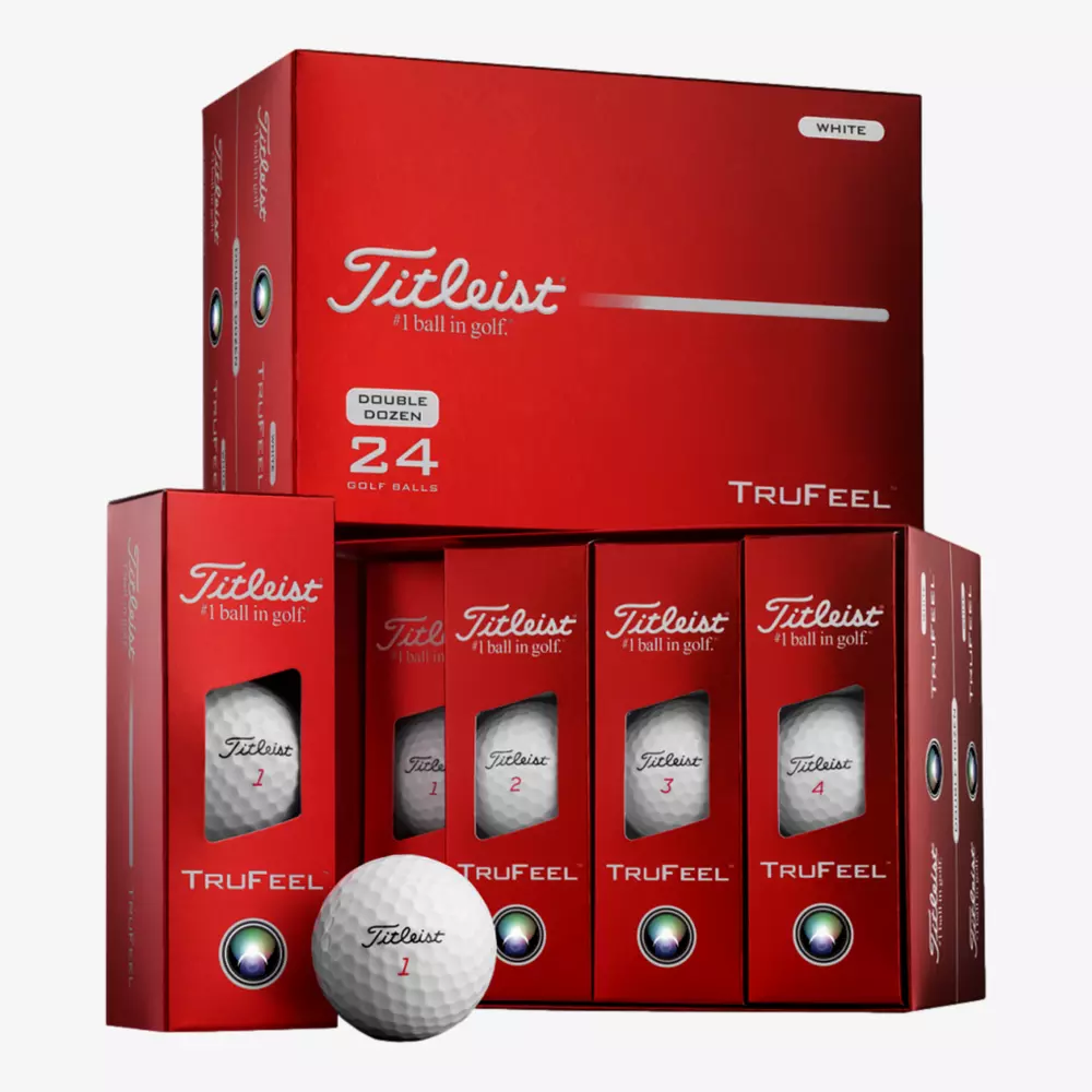 A display of red Titleist TruFeel golf ball boxes, including a large Double Dozen box and four smaller boxes, with a white Titleist ball on the front—perfect for those looking for the best deals under $50.
