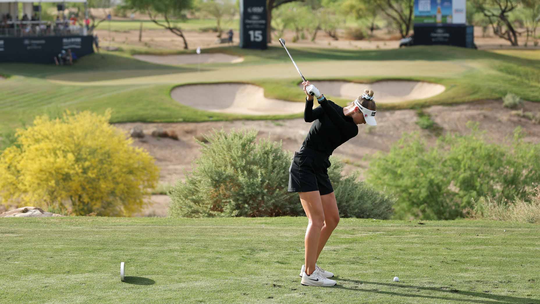 Nelly Korda hits an iron shot into a par-3