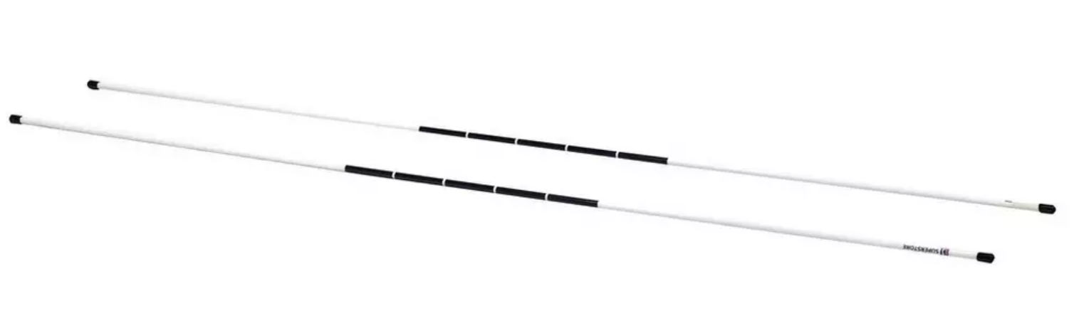 Two long, white canes with black grip sections and black end tips—reminiscent of the iconic flagsticks seen at the PGA Championship—are laid out diagonally on a white background, serving as essential mobility aids for individuals with visual impairments.