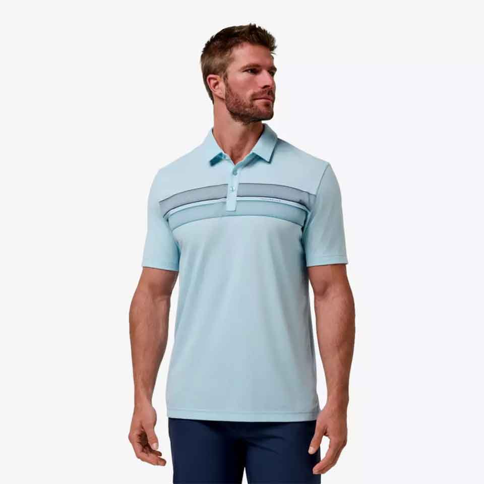 A man wearing a light blue short-sleeve polo shirt with horizontal striped accents across the chest and dark blue pants stands against a plain white background—perfect for golf gifts or stylish Father’s Day gifts.