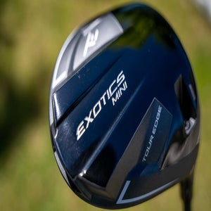 Tour Edge Exotics Mini Driver in-hand photo on golf course.