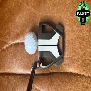 TaylorMade Spider Putter on leather couch