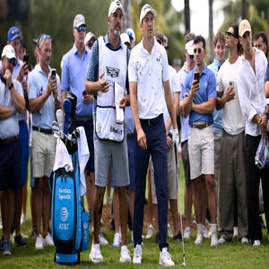 PGA Tour star Jordan Spieth lines up a shot with this caddie at Trump Doral Blue Monster course during the 2026 Cadillac Championship.