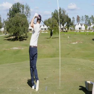 golf.com game-improvement editor zephyr melton swings a driver and hits ball left