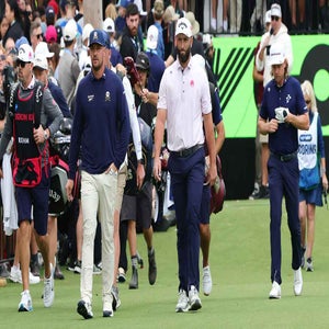 Bryson DeChambeau of the Crushers GC and Jon Rahm of Legion XIII and Cameron Smith of Ripper GC walk down the 1st during day one of LIV Adelaide