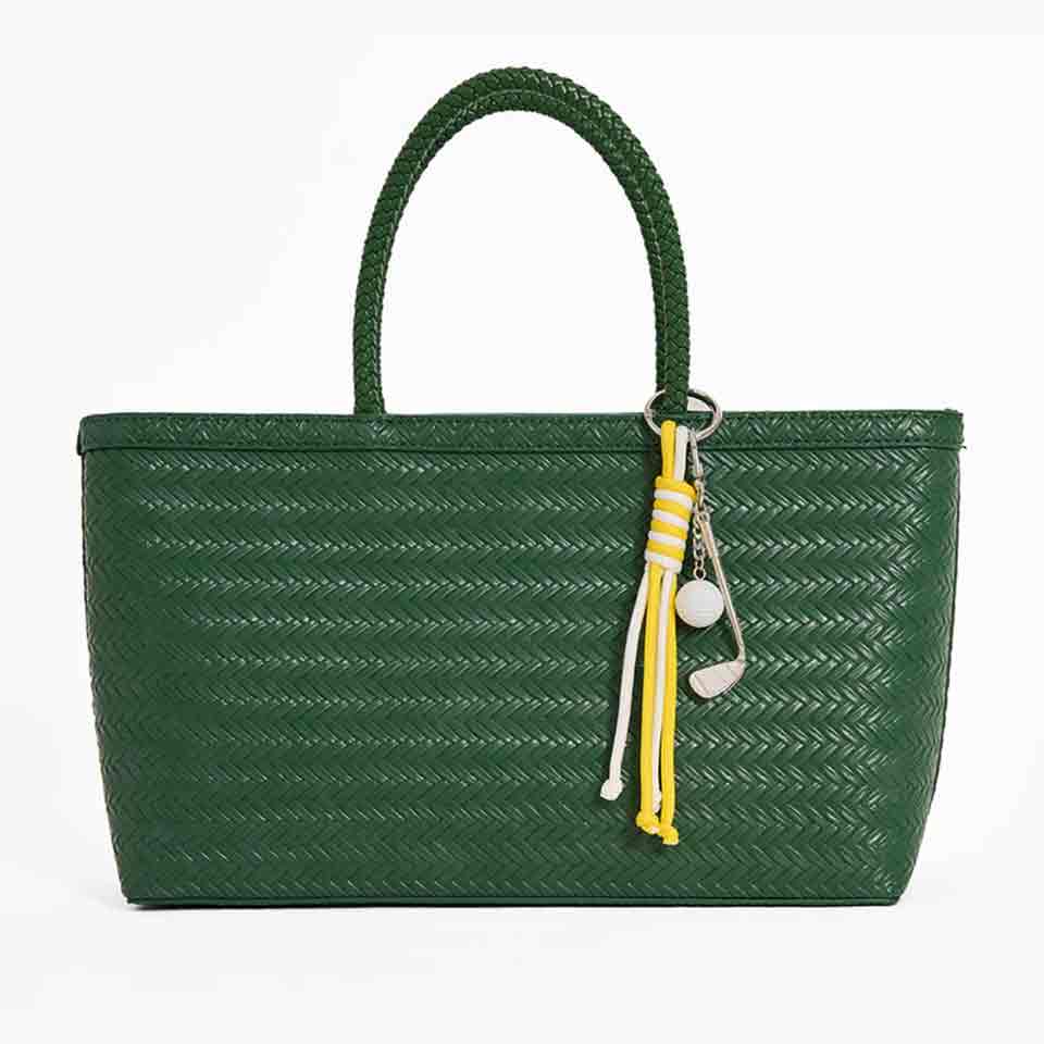 A green woven single-handle luggage bag with a decorative yellow and white fringe chain and a white ball charm—perfect for stylish accessories or thoughtful Mother's Day gifts.