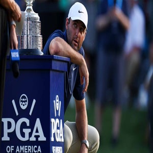 2026 PGA Championship odds: Scottie Scheffler squats next to Wanamaker trophy.