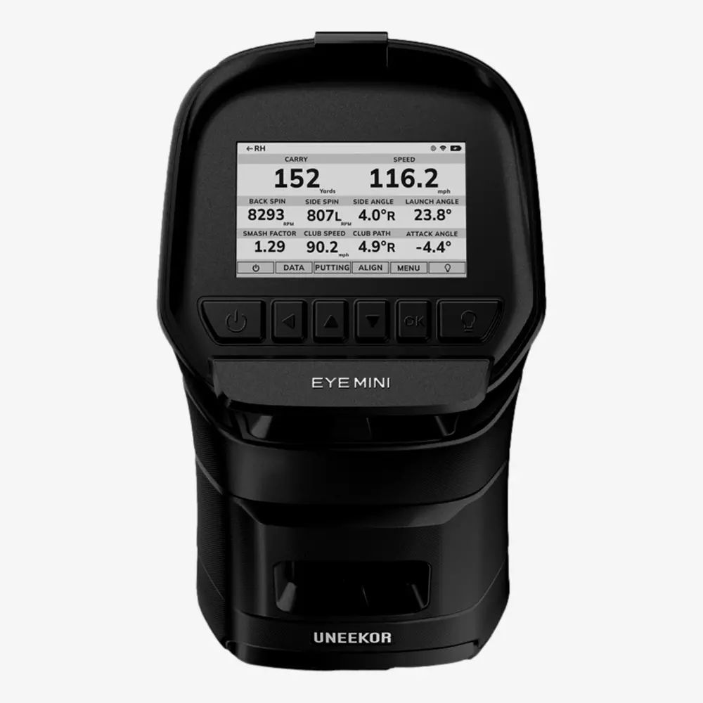 A black Uneekor EYE MINI golf launch monitor with a screen displaying golf shot metrics such as carry distance, speed, backspin, and launch angle—because is summer the right time to buy rain gear? Yes! Control buttons sit just below the screen.