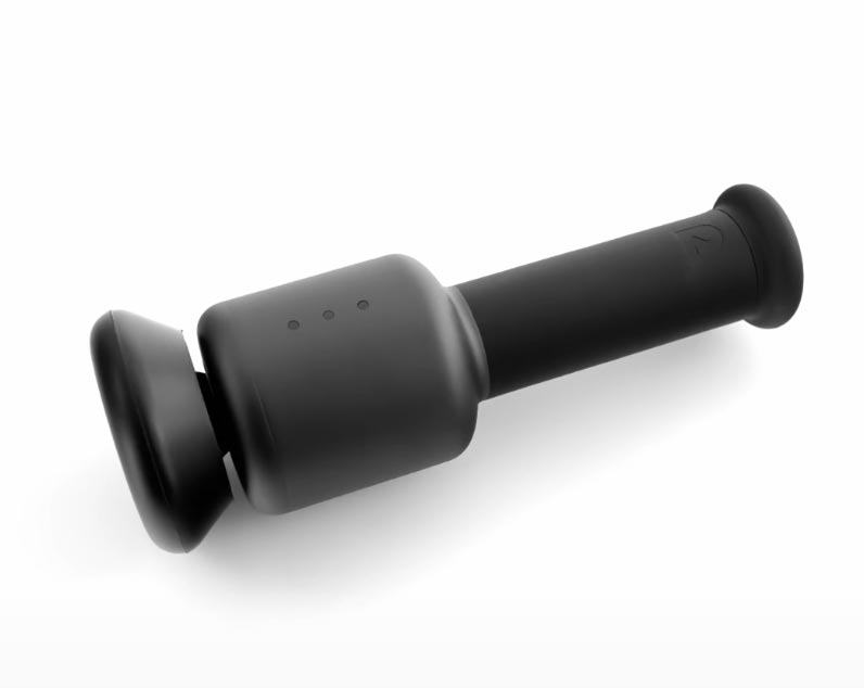 A sleek, black portable massager with a cylindrical handle and two flat, rounded ends lies against a white background. Three small indicator lights are visible on the side - an ideal choice for Father's Day gifts.
