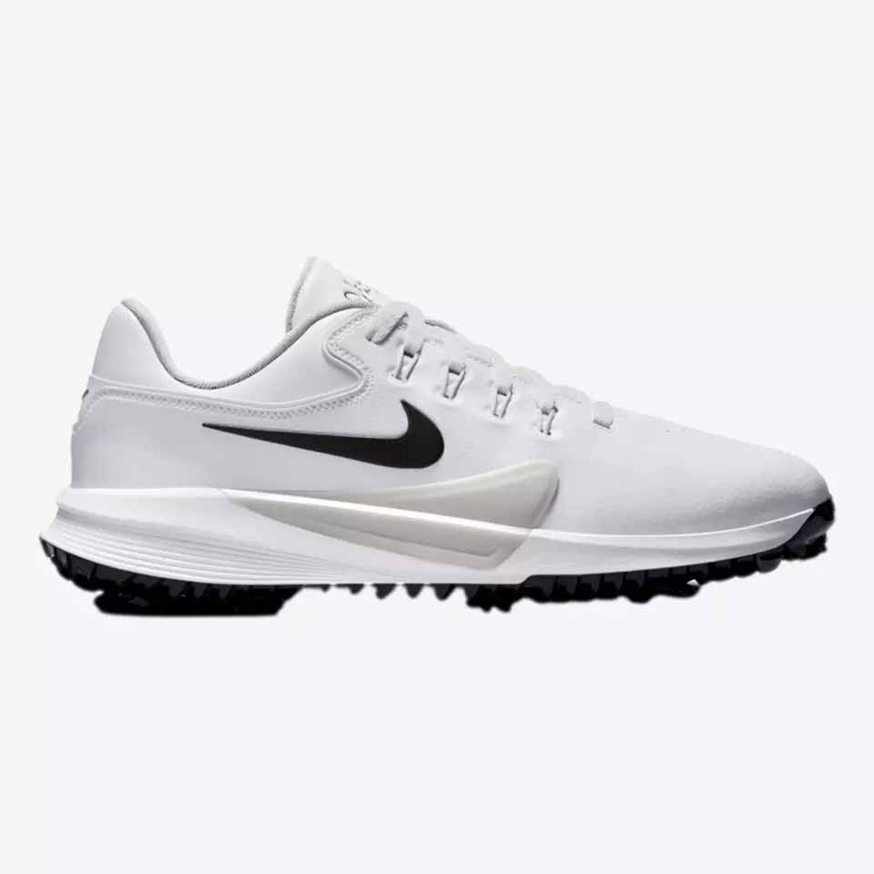 White athletic shoe with a black Nike swoosh logo, black sole, and spiked tread. The shoe design appears sleek, with a low profile and lightweight construction—just like Nike golf shoes worn by Scottie Scheffler—perfectly suited to support a powerful swing during sports or outdoor activities.